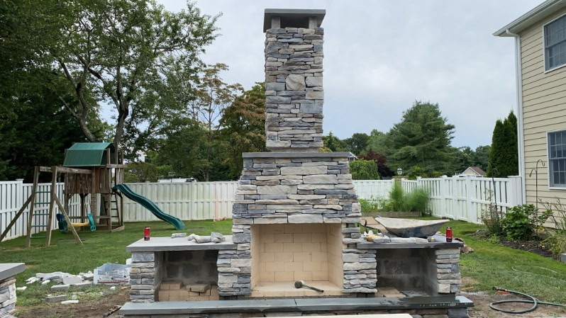 Outdoor Stone Fireplace completed by Colonial Crete in Long Island, NY